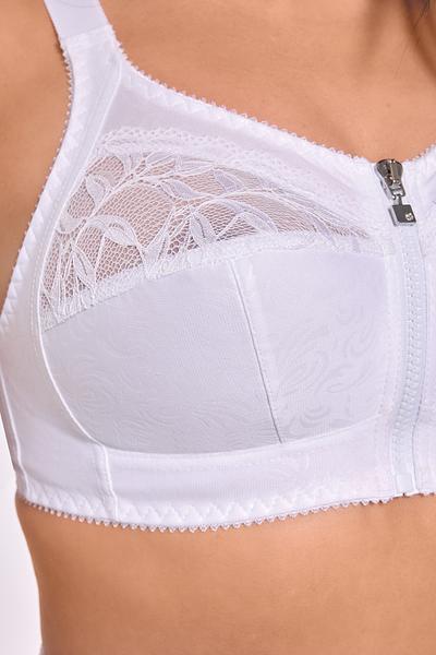 Ten biustonosz to połączenie wygody, funkcjonalności i subtelnej kobiecości. Wykonany z oddychających materiałów – 73% poliamid, 20% bawełna i 7% elastan – idealnie dopasowuje się do sylwetki, jednocześnie zapewniając uczucie lekkości i komfortu przez cały dzień. Model typu soft bez fiszbin delikatnie podtrzymuje biust, a zapięcie z przodu na zamek błyskawiczny ułatwia zakładanie i zdejmowanie. Doskonały dla kobiet ceniących praktyczność i wygodę, również po zabiegach lub w czasie rekonwalescencji.